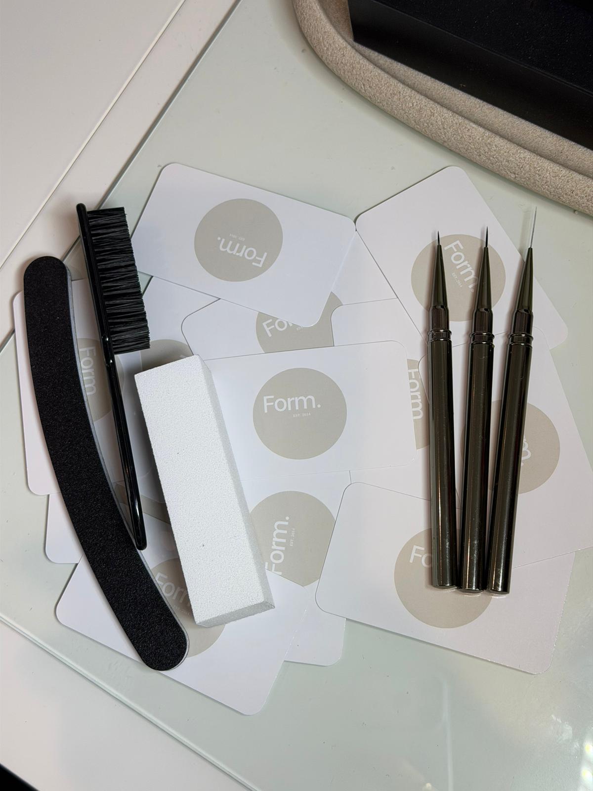Nail tools and Form. cards on the desk